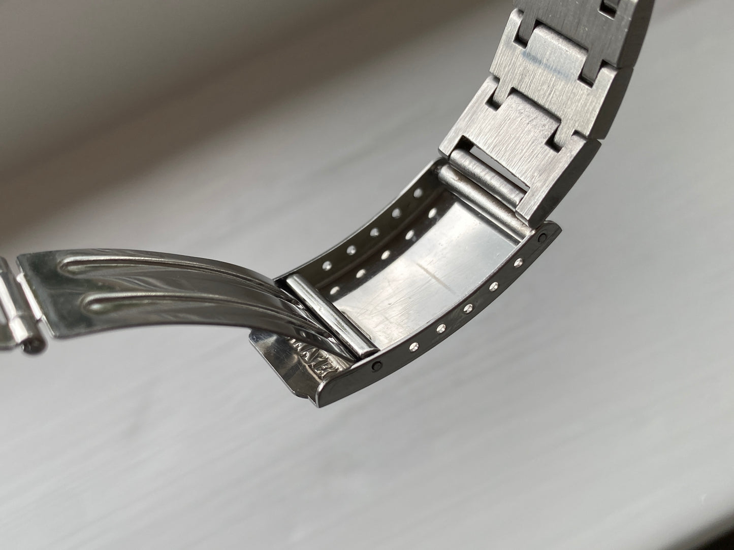 Vintage Citizen Cosmotron watch with purple and turquoise dial with gold details and day/date feature, faceted crystal, stainless steel bracelet and 7802 movement, inside of clasp