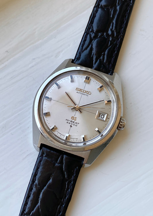 Vintage Grand Seiko 6145-8000 hi-beat 36000 automatic watch with champagne crosshair dial on a leather strap, front view