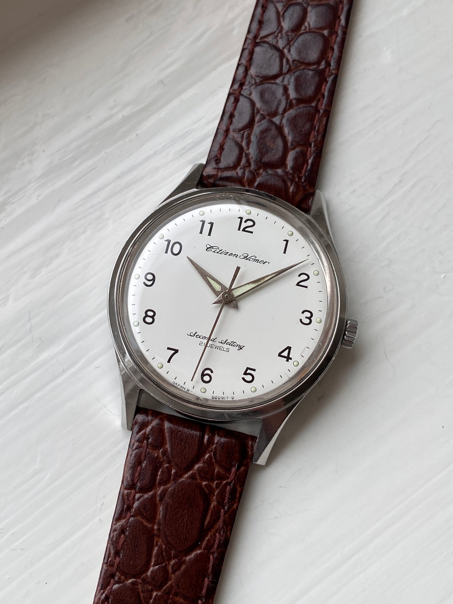 Vintage hand wound Citizen railway watch, Homer Second Setting, with white dial on a leather strap, front view