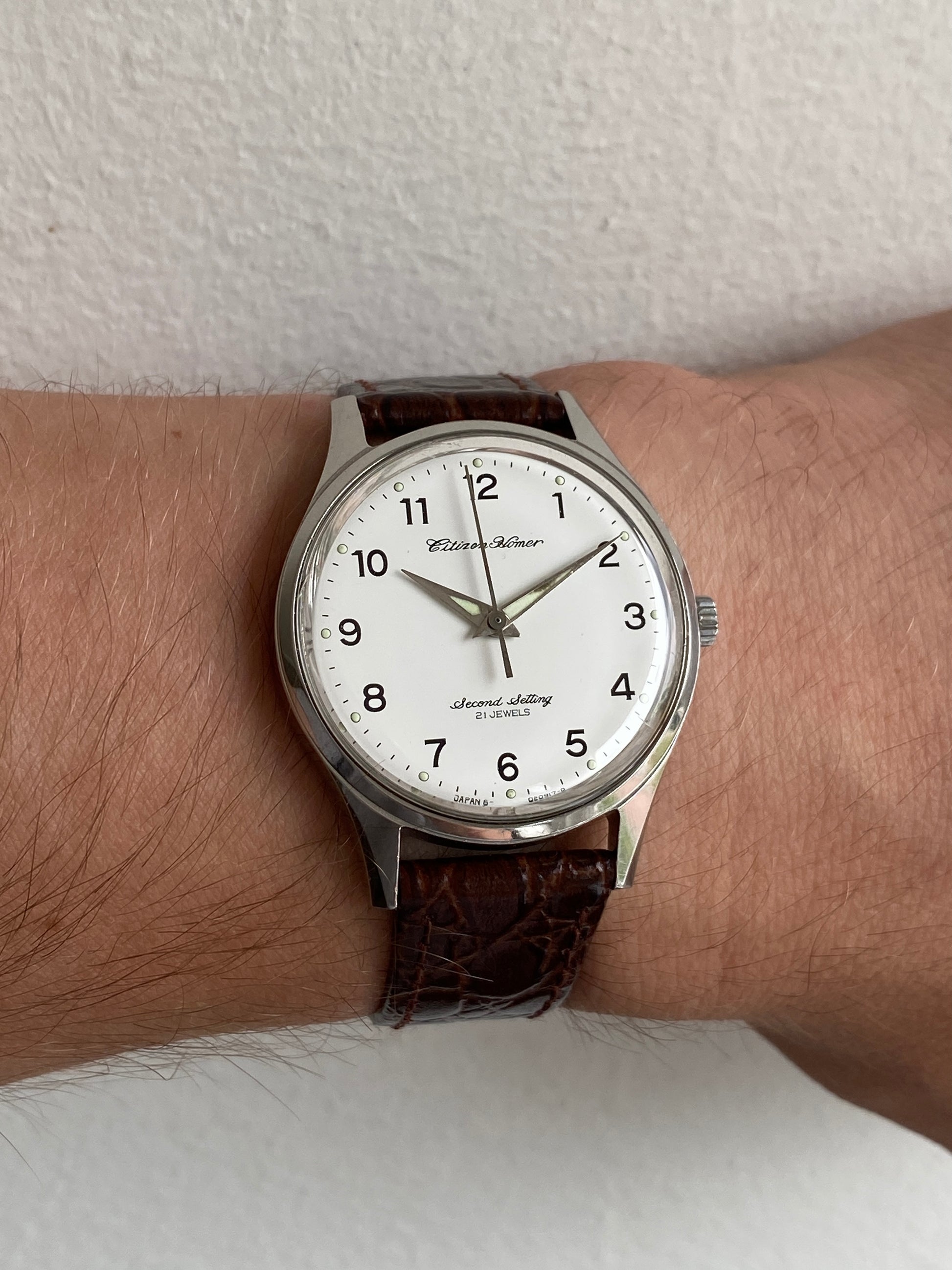 Vintage hand wound Citizen railway watch, Homer Second Setting, with white dial on a leather strap, wrist shot